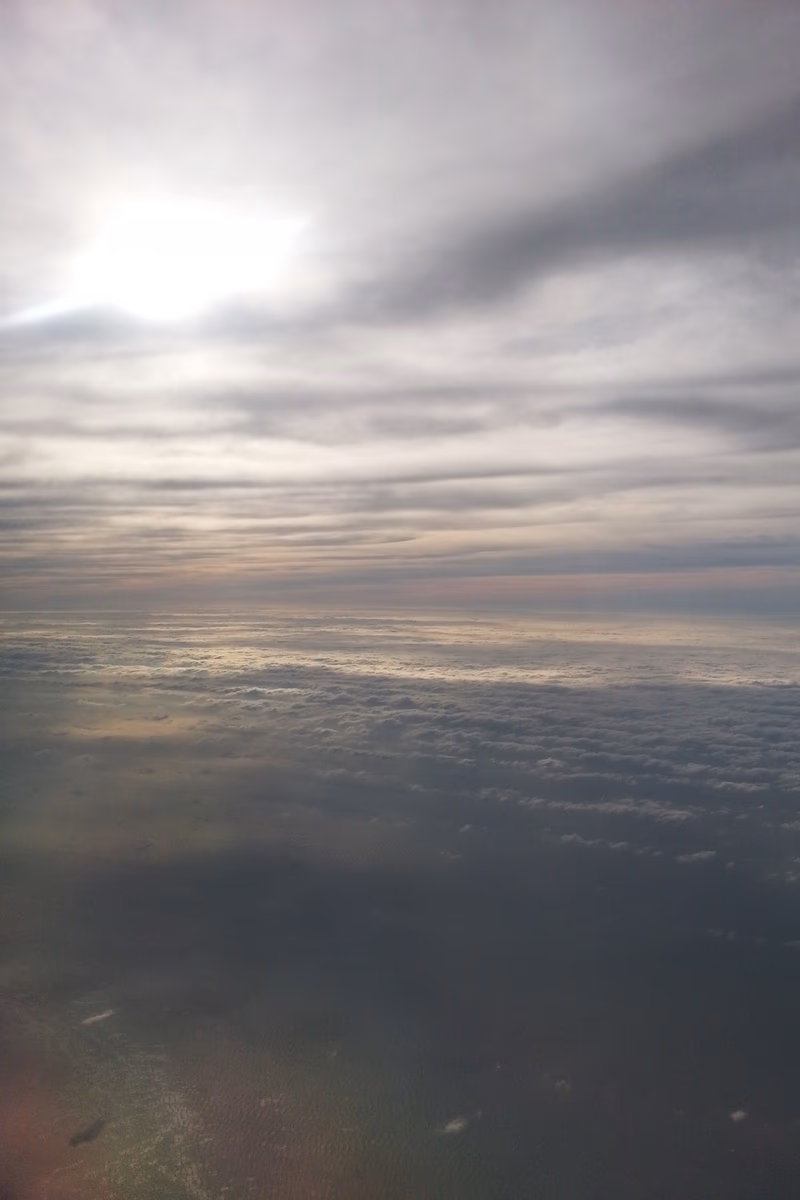 A beautiful view of the sky with clouds and the sun.